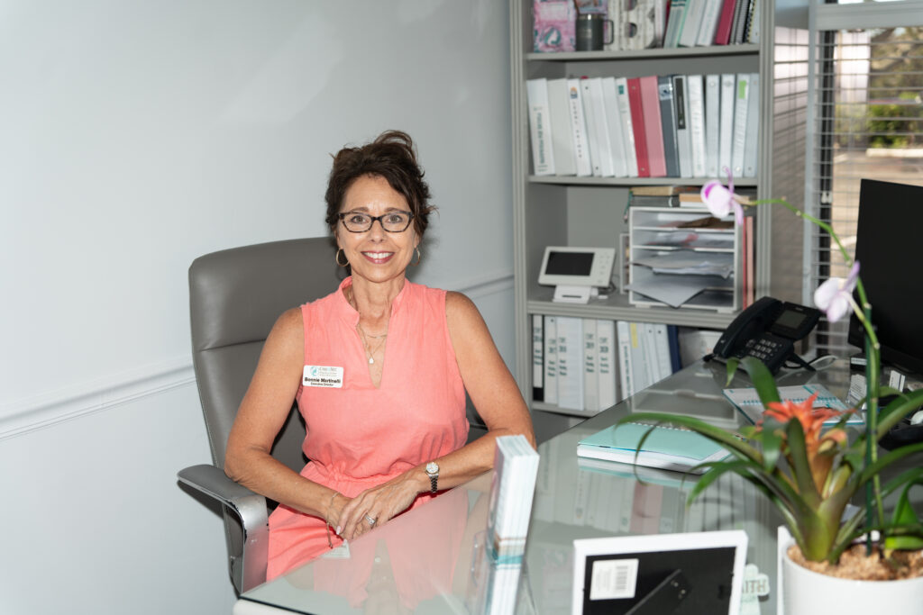 Bonnie at her work desk at Care Net